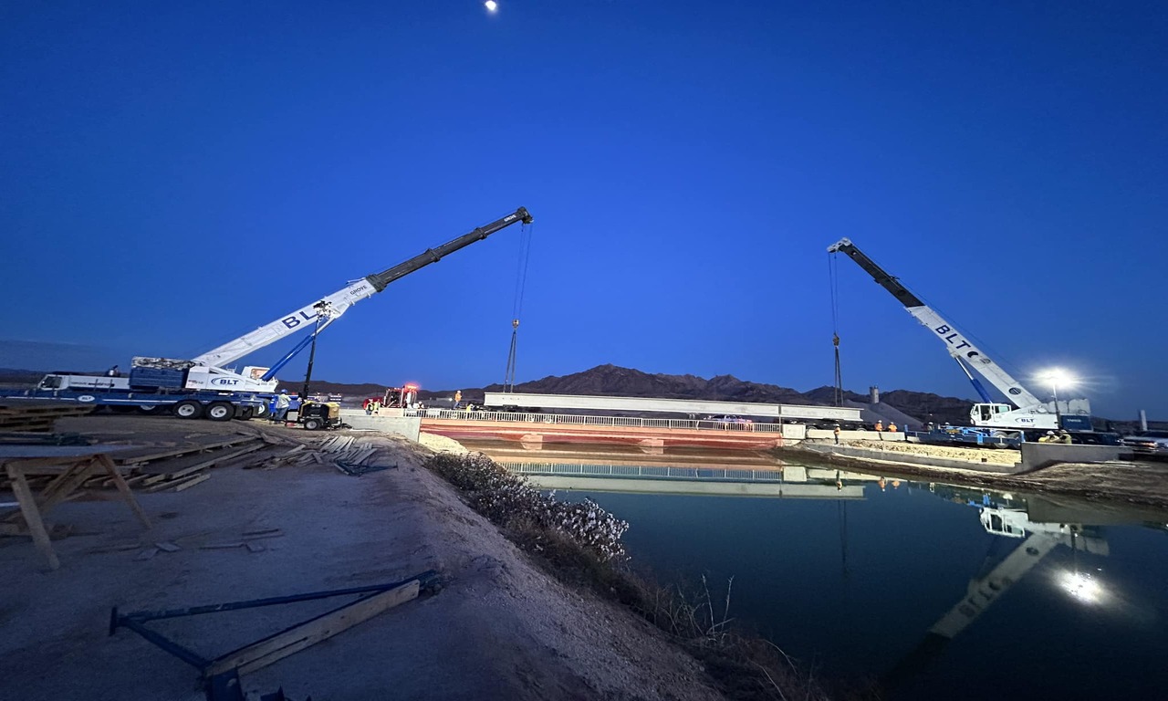 Two BLT Cranes Placing a Bridge Over. A Canal (1)